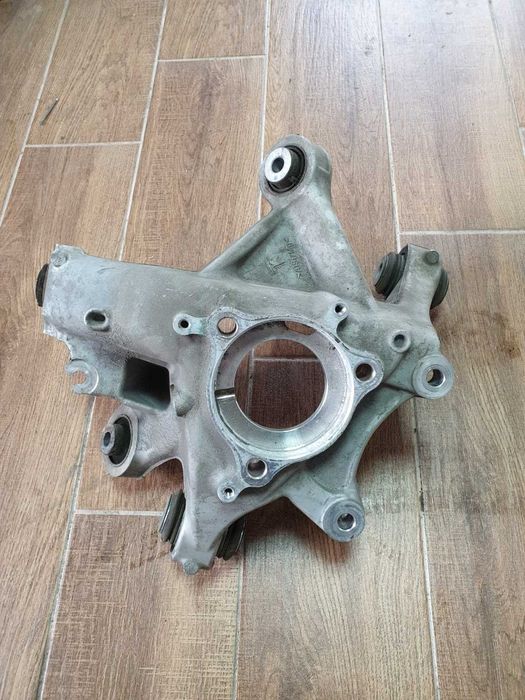 Цапфа поворотний кулак передній задній павий лівий Tesla Model Y