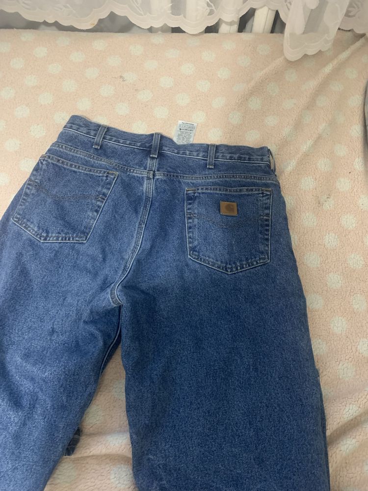 Spodnie oryginalnie  jeansy Carhartt w rozmiarze L