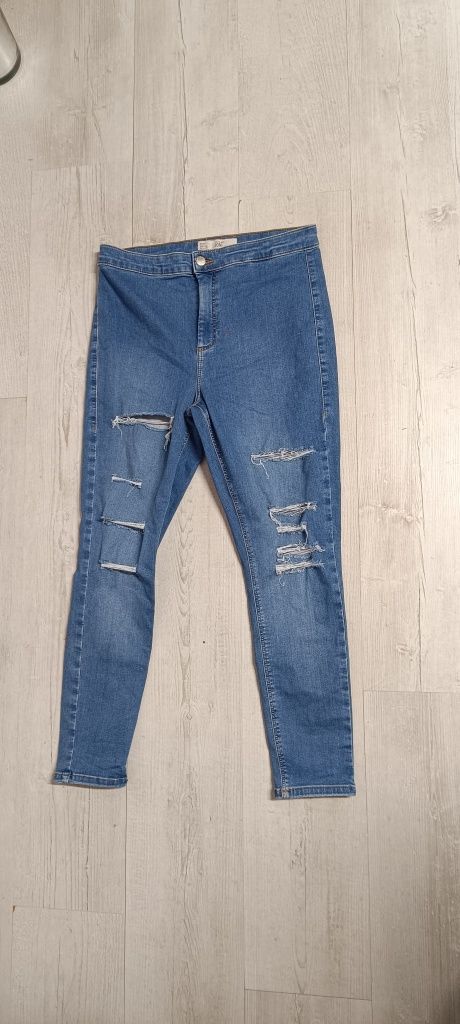 Spodnie dżinsowe typu rurki z podarciami rozmiar W34 L30