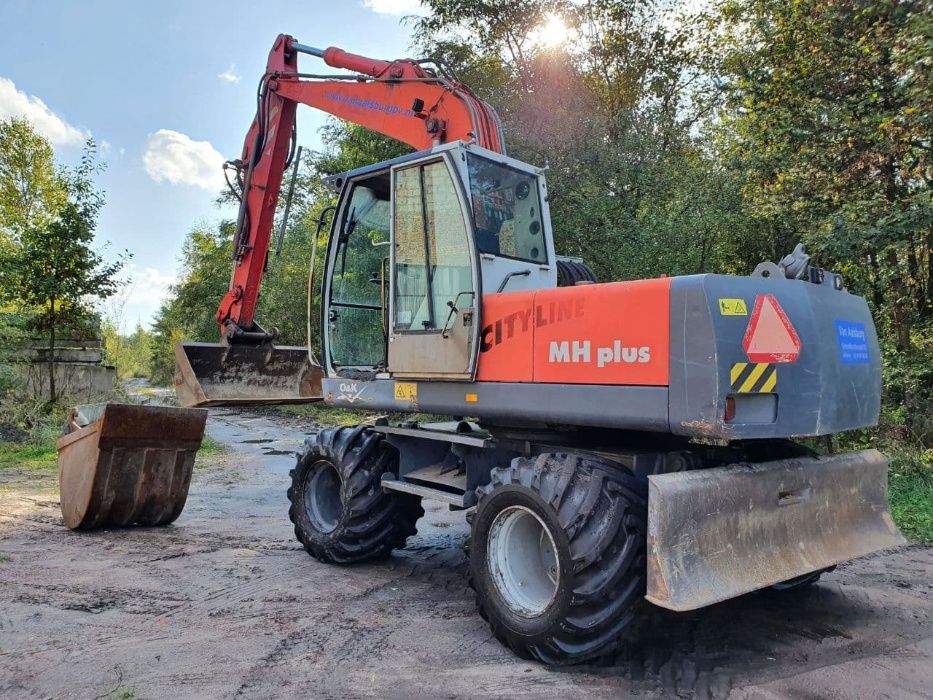 Оренда/послуги екскаватора O&K MH Plus екскаватор колісний спецтехніка