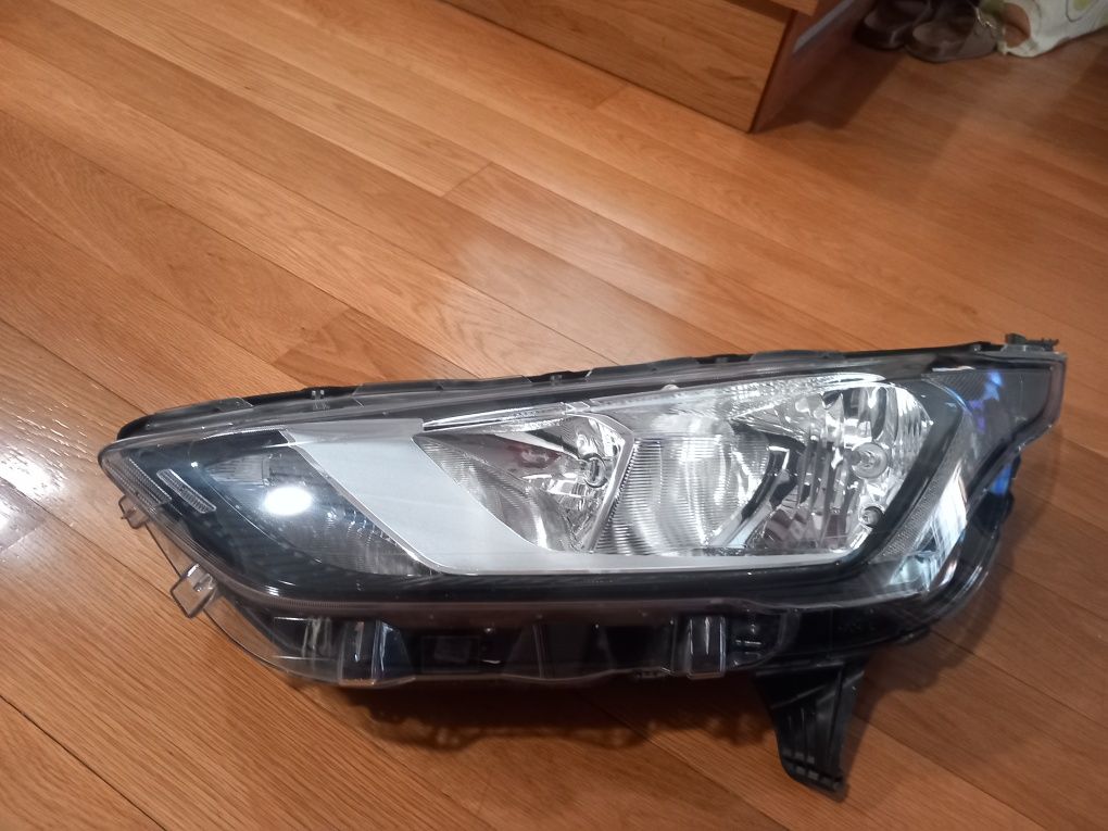 Farol optica frente esquerda Ford Transit Connect do ano 2018 a 2025.