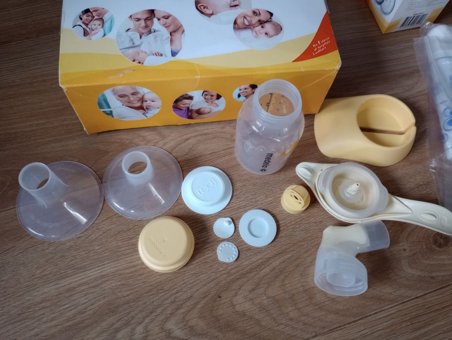 Medela laktator ręczny, wkładki latacyjne, woreczki + butelka