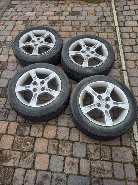 Felgi 15''  + opony. oryginał Mazda 323F