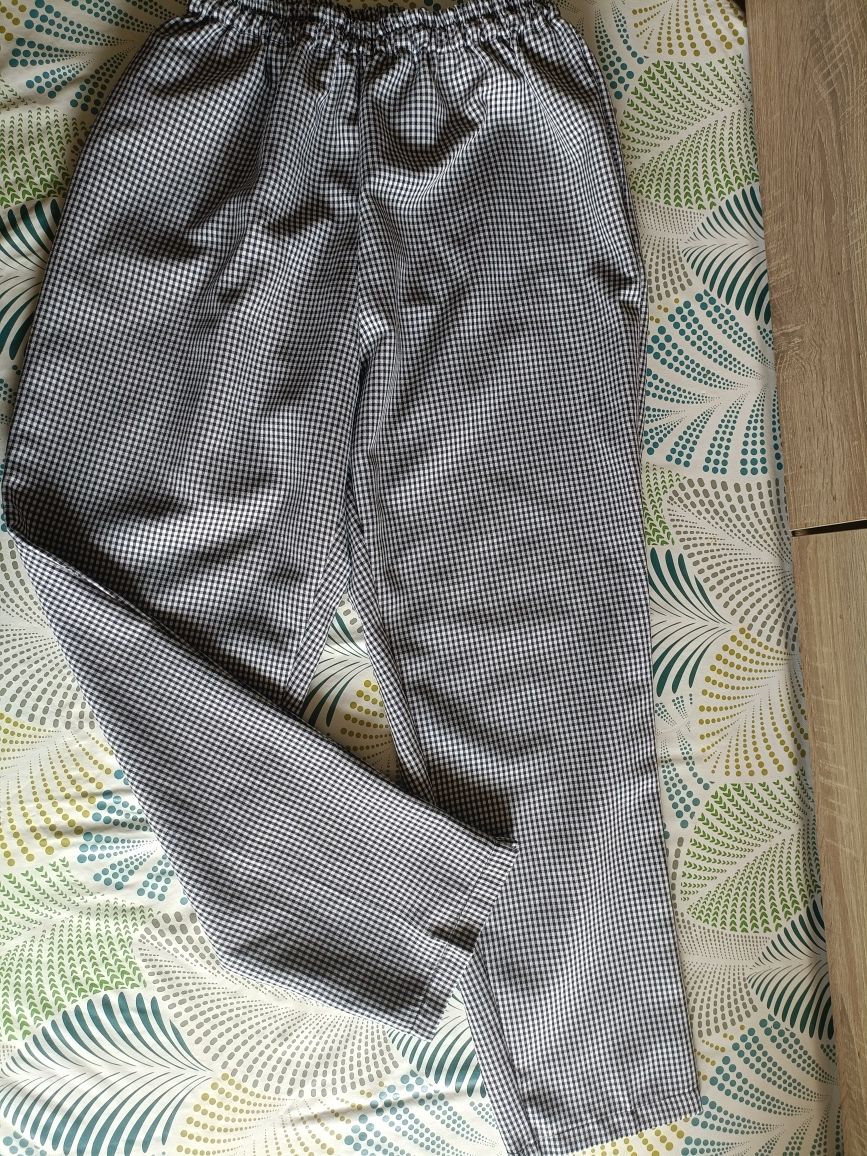 Eleganckie spodnie w pipetke plus size