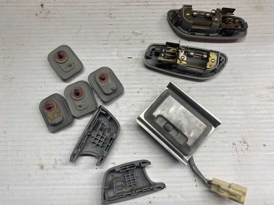 Плафони заглушки світильники кріплення вимикачі світла салону Лансер 9