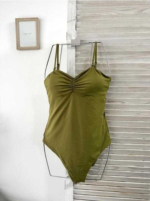 Суцільний зелений купальник розмір s