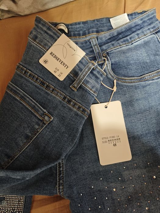 Spodnie jeans r50 z dziurami