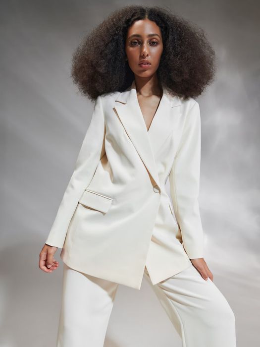 Жіночий кремовий довгий блейзер XL в стилі кежуал