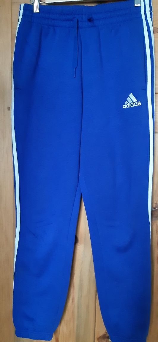 Oryginalne spodnie Adidas w niebieskim kolorze. S