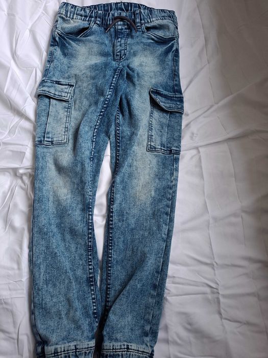 Spodnie jeansy i materiałowe chłopięce 8szt.