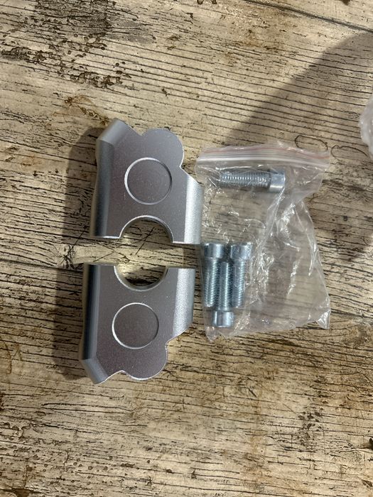 Extensor universal para guiador moto