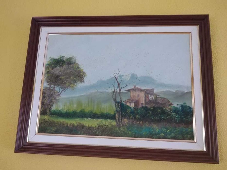Quadros com paisagens em caixilho de madeira