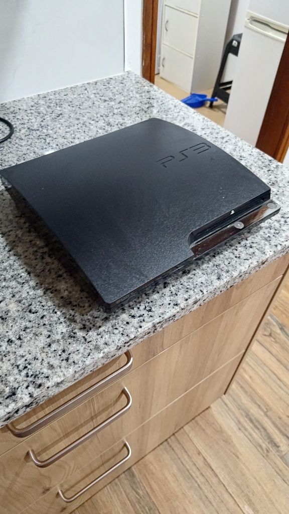 PS3 com vários jogos