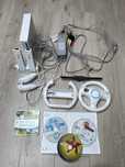 Konsola Wii + akcesoria + 4 gry