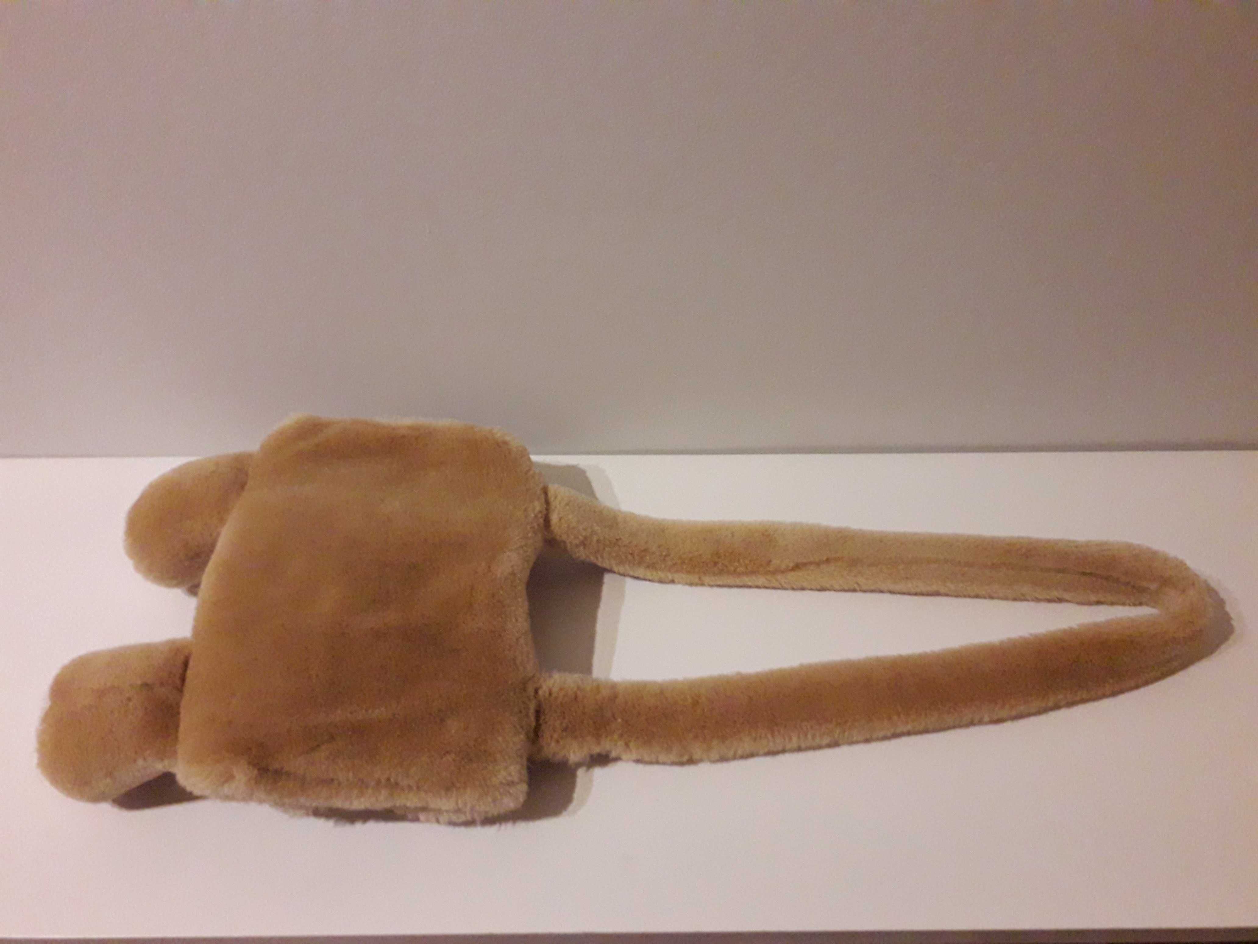 Peluche mala e aquecedor de mãos