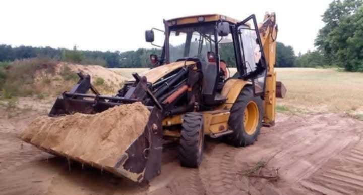 Usługi Koparko ładowarką CAT 428C oraz transport od 20t.