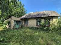 Земельна ділянка з будинком