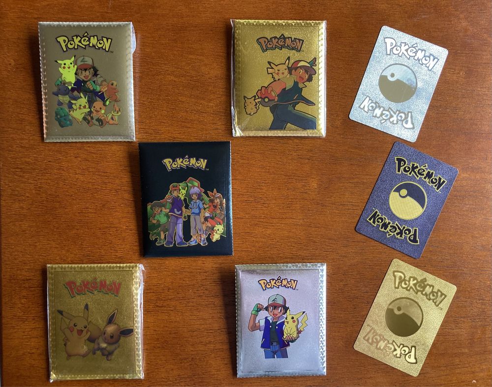 Cartas pokémon douradas prateadas, pretas e coloridas