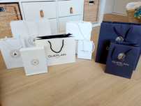 Sacos da marca Guerlain