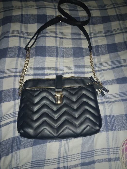 Carteira de mão em bom estado, pouco usada