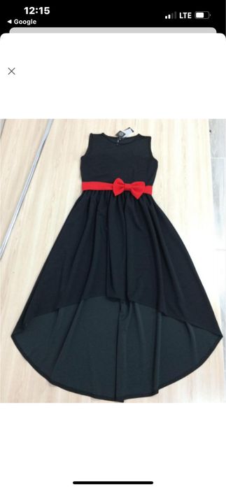 Дуже гарна сукня з червоним бантом