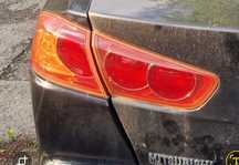 Lampa lewy tył lewa tylna Mitsubishi Lancer VIII sedan w błotnik