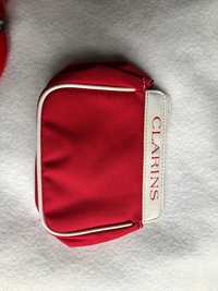 bolsa vermelha clarins