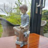 Porcelanowa figurka Zaphir by Lladro chłopiec z ptaszkiem