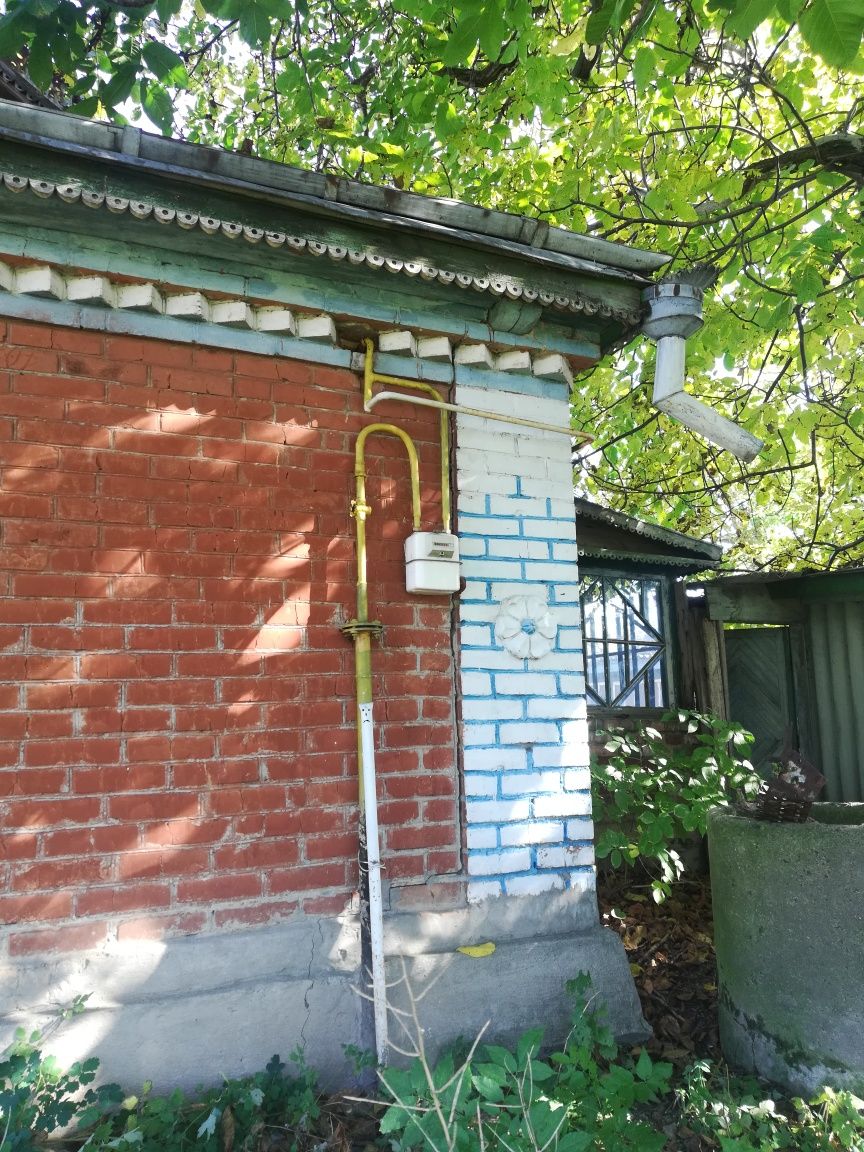 Продам земельну ділянку з будинком..