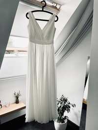 Długa romantyczna suknia ślubna w stylu greckim z rozcięciem