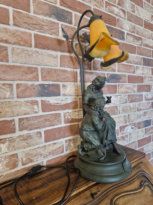 Ciężka lampa stojąca - żeliwna z motywem