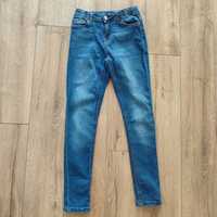 Jeansowe spodnie rurki 134/140 Destination jeansy wąskie