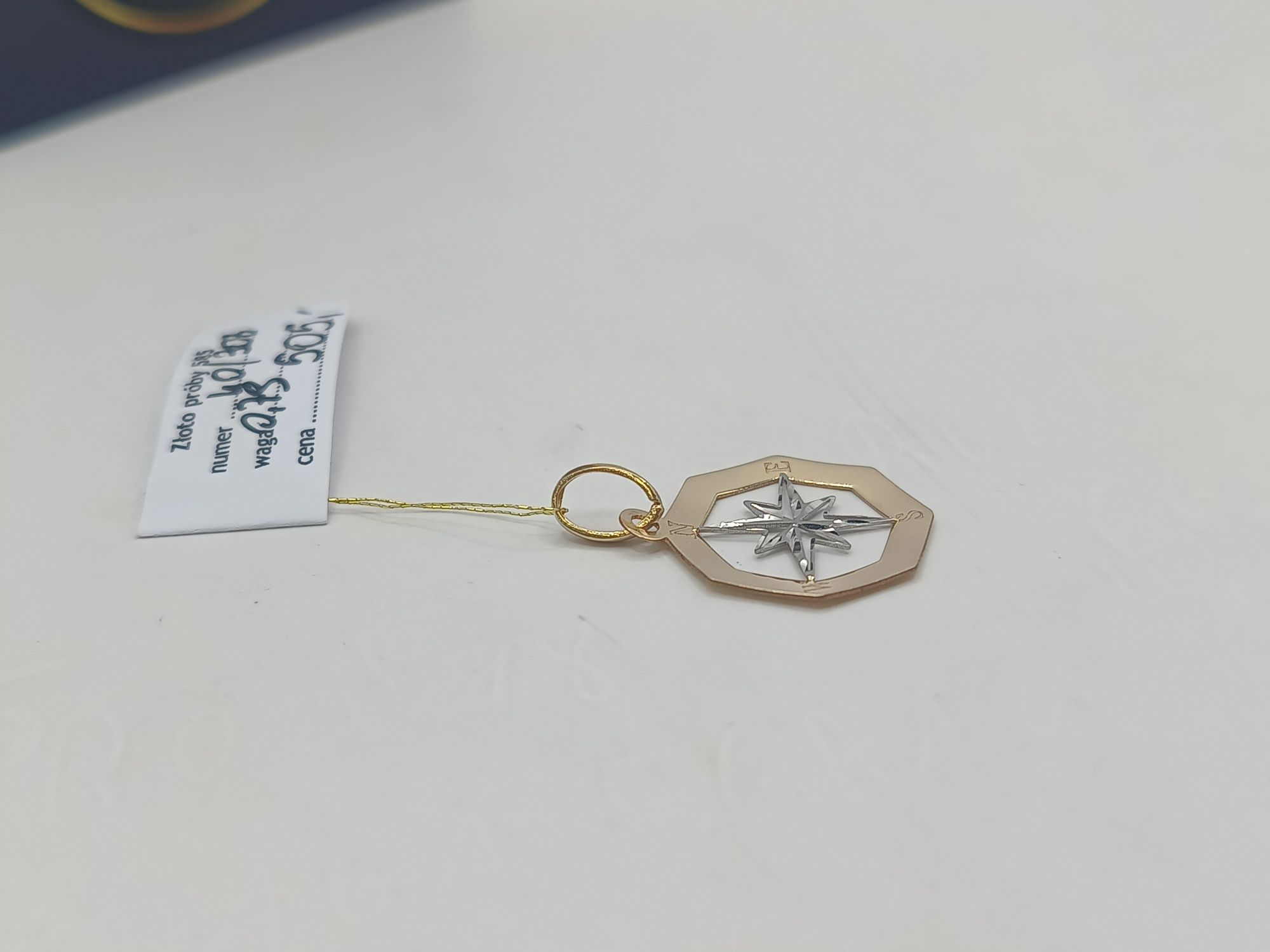 Złota zawieszka gwiazda północy  żółto białe złoto pr 585 14 karat