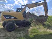 Koparka kołowa cat 315 jcb