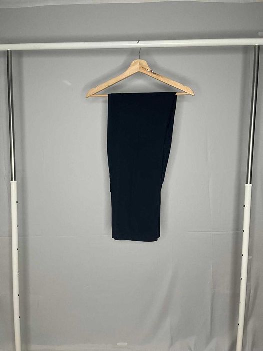 Calças azuis escuras, como novas.