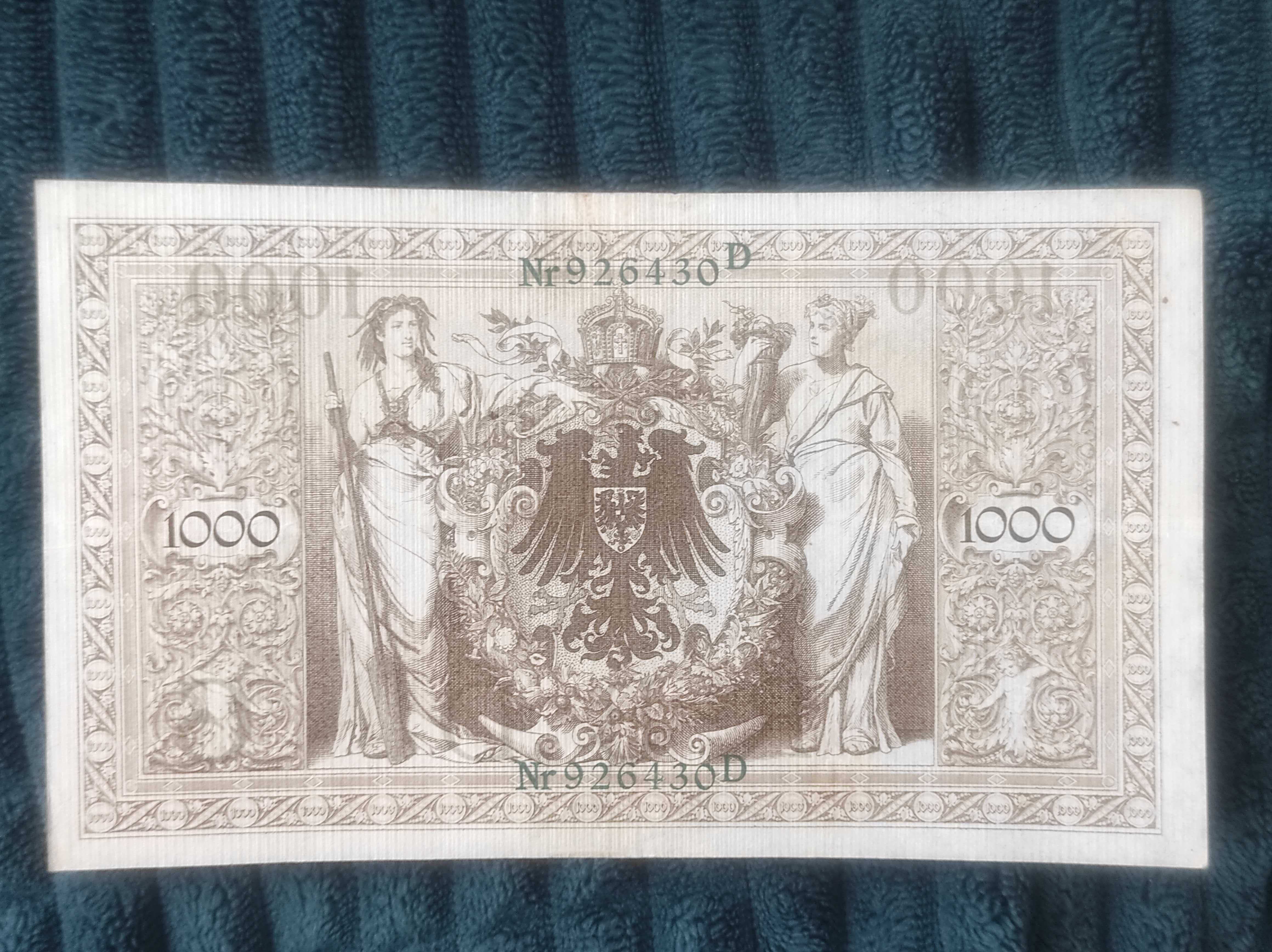 Banknot Niemcy 1000 Marek 1910 z zielonym numerem i pieczęcią.