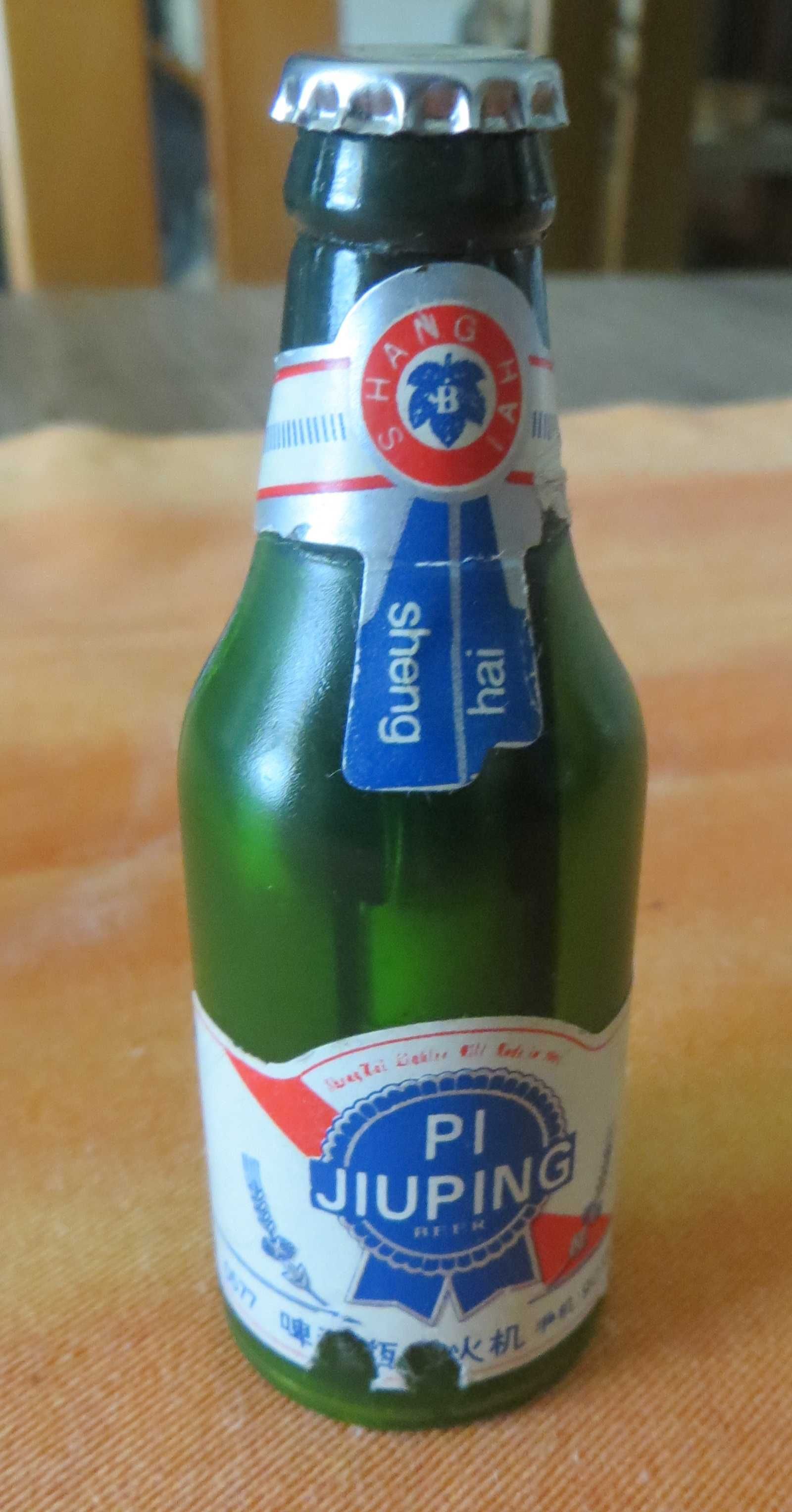 Isqueiro garrafa PI-Jiuping, a gás, carregável - anos 40, Origem Macau