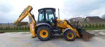 Koparko ładowarka JCB 3 CX wraz z operatorem.