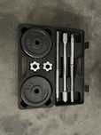 Mala compacta com barra e discos fitness 25kg no total