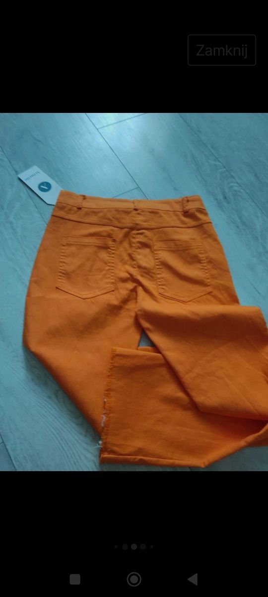 Spodnie damskie rozmiar 36,pomarańcz ,elastyczne ,szarpana nogawka