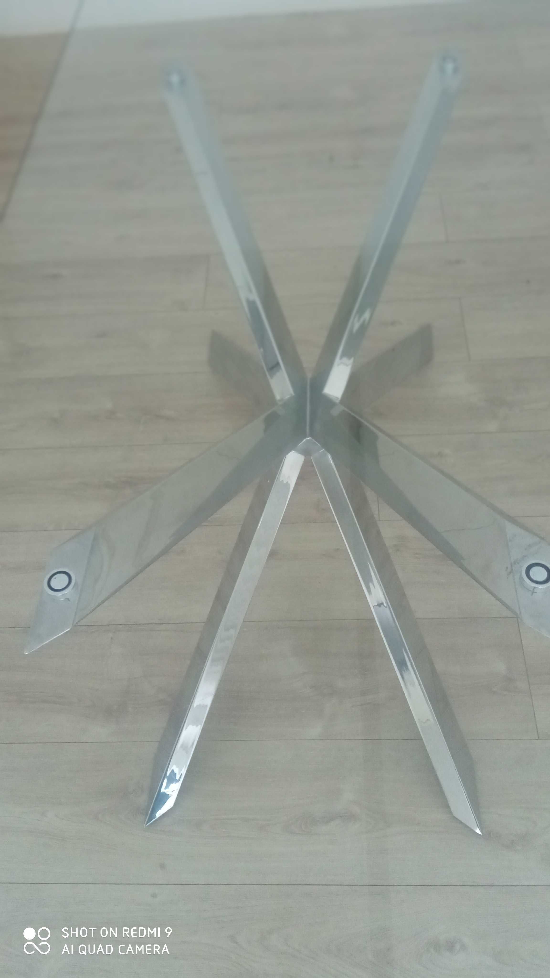 Mesa de vidro com pé em inox