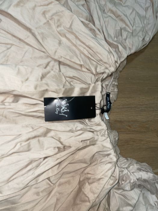 Сарафан бежевого кольору вільний