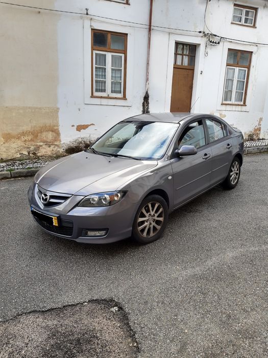 Faróis Ópticas Mazda 3 sedan 2008