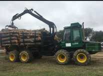 Maquina de rechega timberjack 1210B