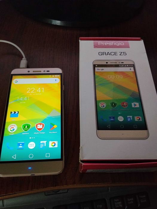 Мобильний телефон смартфон Prestigio grace z5 dual SIM Golden Золотой