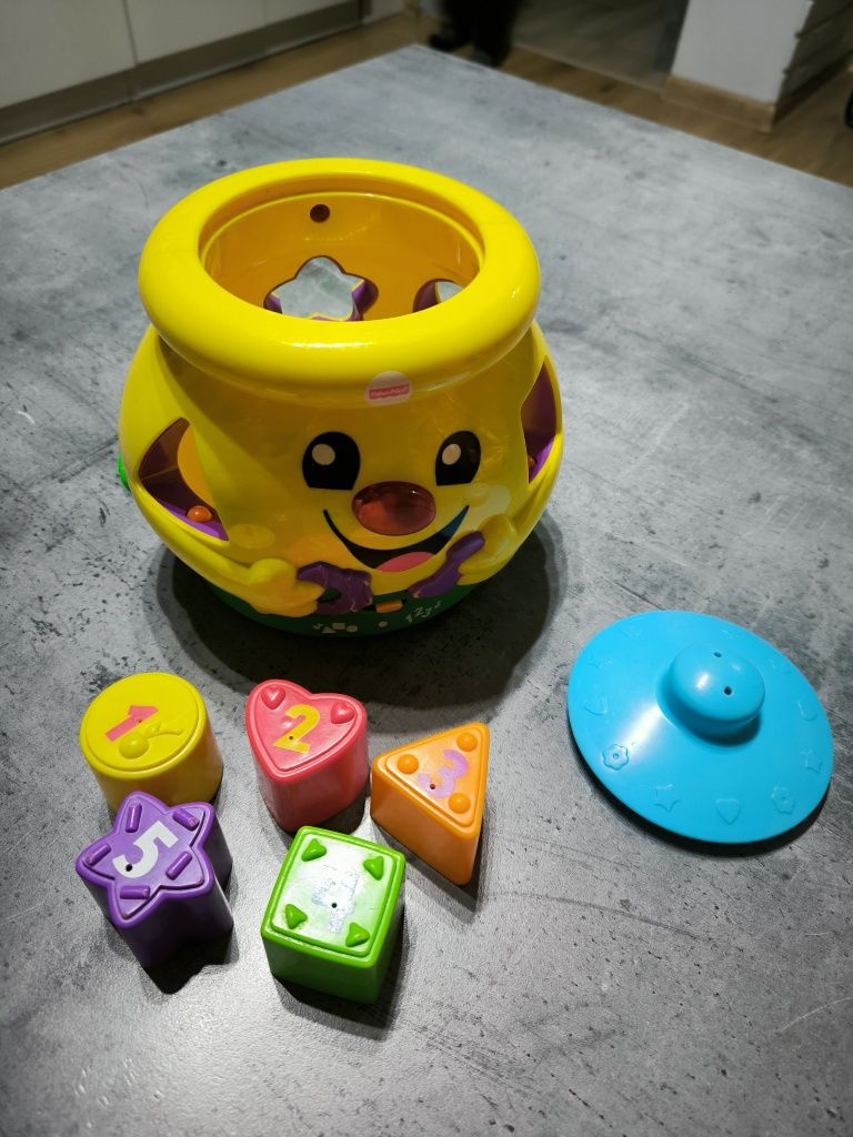 Garnuszek na klocuszek Fisher Price polska weraja