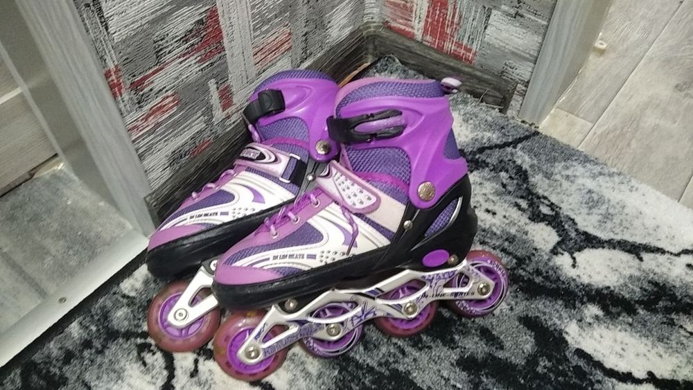 Ролики фіолетові б/у.