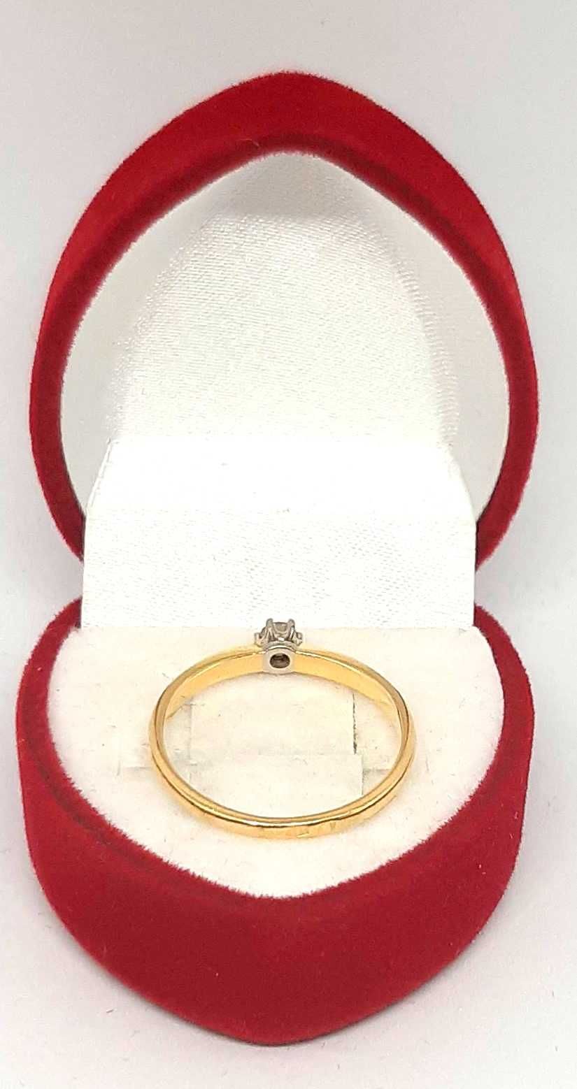 Złoty pierścionek z Brylantem 0,08ct PR.585 W:1,51gr R.12 ,