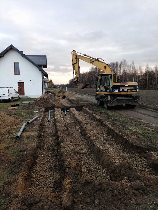 USŁUGI  koparką  KOŁOWĄ OBROTOWĄ   roboty ziemne  wykopy