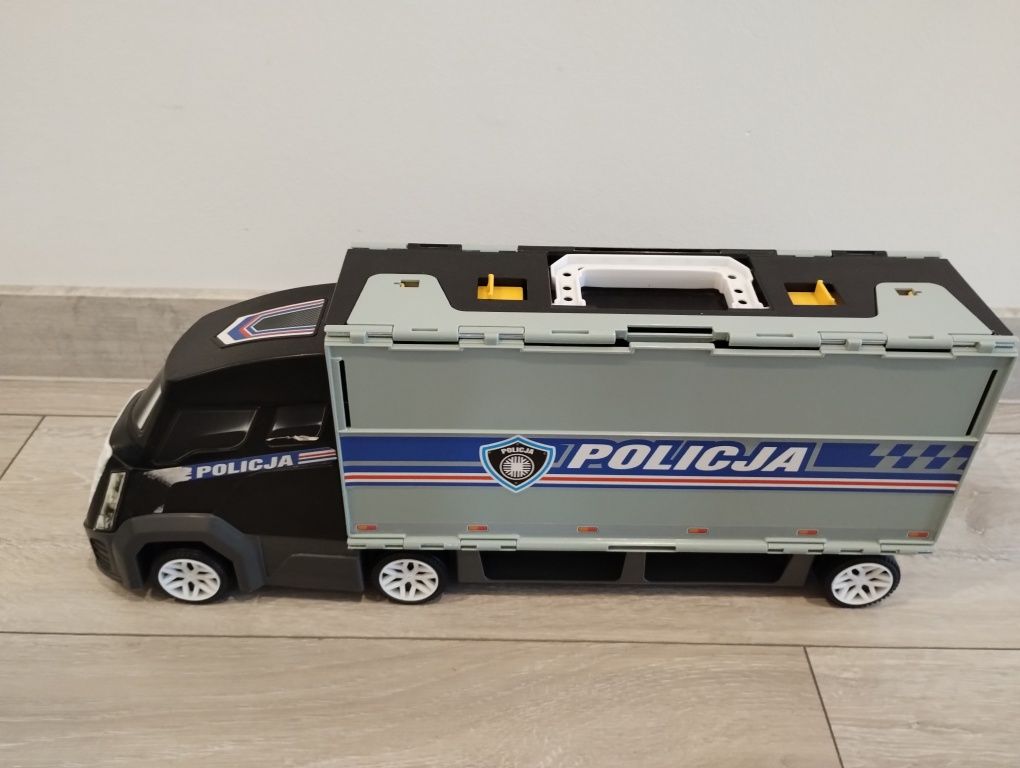 Samochód policyjny z zjezdzalnią , walizka